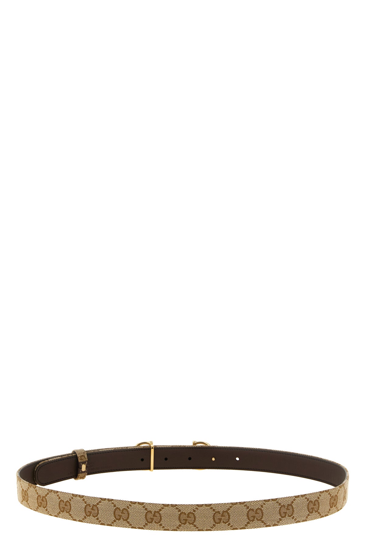 the gucci reversible belt defines the silhouette through a dual construction of