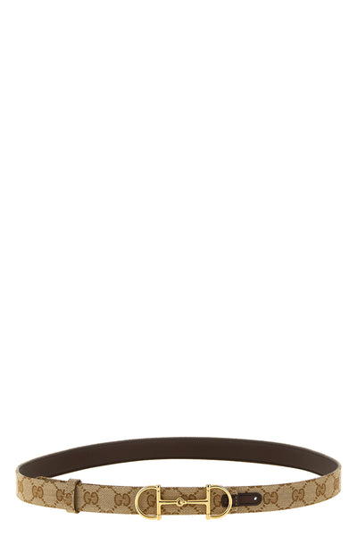 the gucci reversible belt defines the silhouette through a dual construction of