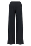 gucci tailored trousers redefine everyday elegance through a loose