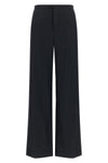 gucci tailored trousers redefine everyday elegance through a loose