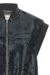 the peserico vest redefines the codes of clothing in layers through a sleeveless