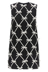 moschinos mini dress redefines the trapezoid silhouette through a sartorial con