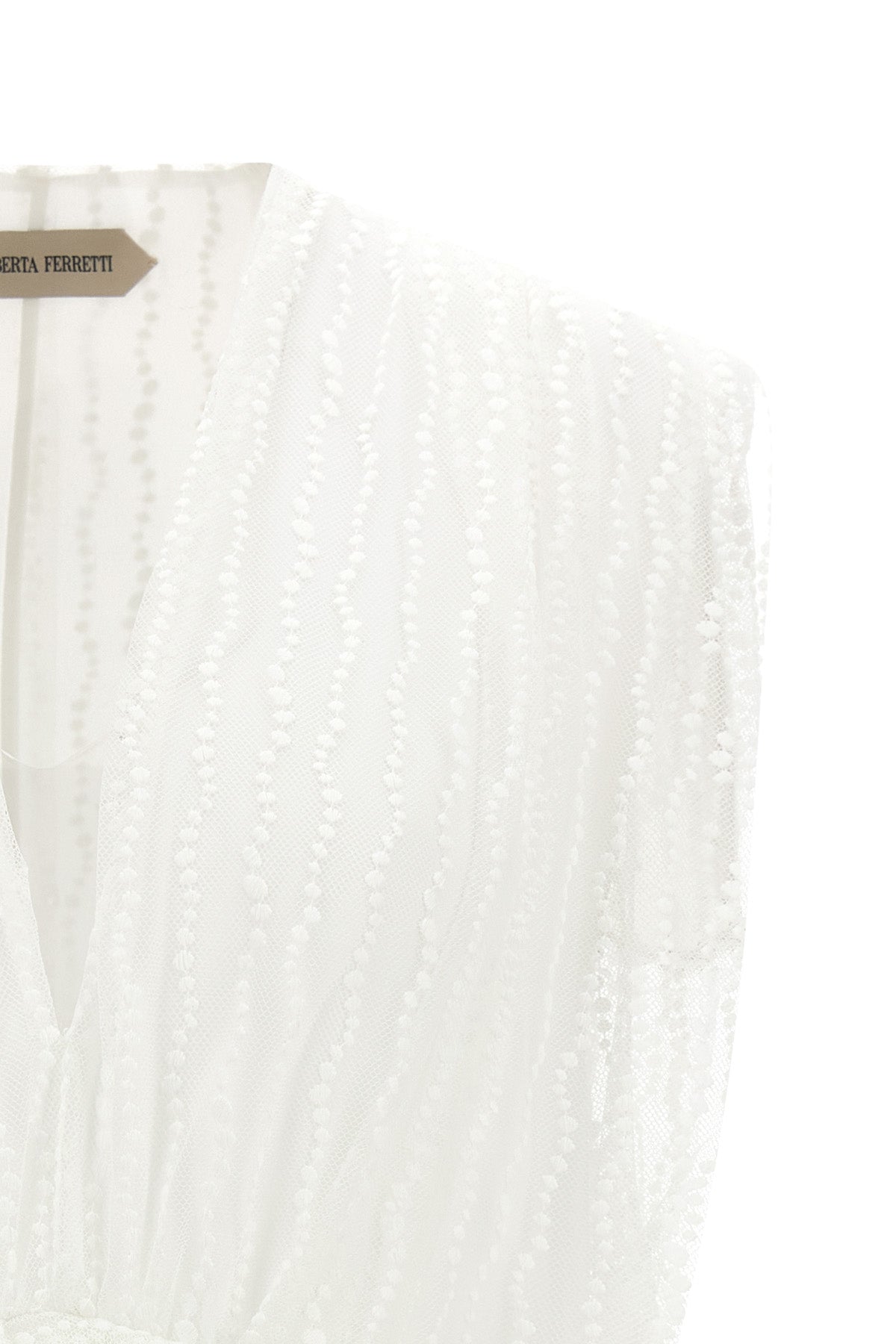 the alberta ferretti tulle top stands out for its ethereal and asymmetrical silh