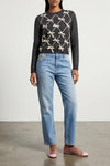 moschinos sweater redefines classic knitwear through an elaborate contrast work