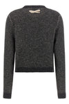 moschinos sweater redefines classic knitwear through an elaborate contrast work