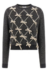 moschinos sweater redefines classic knitwear through an elaborate contrast work