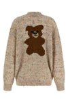 the moschino cardigan redefines contemporary knitwear through a sophisticated bo