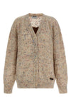 the moschino cardigan redefines contemporary knitwear through a sophisticated bo