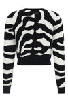the moschino jersey redefines contemporary knitwear through a bold visual narrat