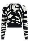 the moschino jersey redefines contemporary knitwear through a bold visual narrat