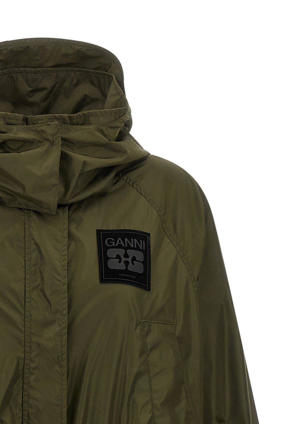 the ganni long windbreaker redefines the volumes of contemporary outerwear throu
