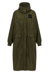 the ganni long windbreaker redefines the volumes of contemporary outerwear throu