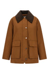 the ganni jacket reinterprets the workwear aesthetic through sartorial volumes a