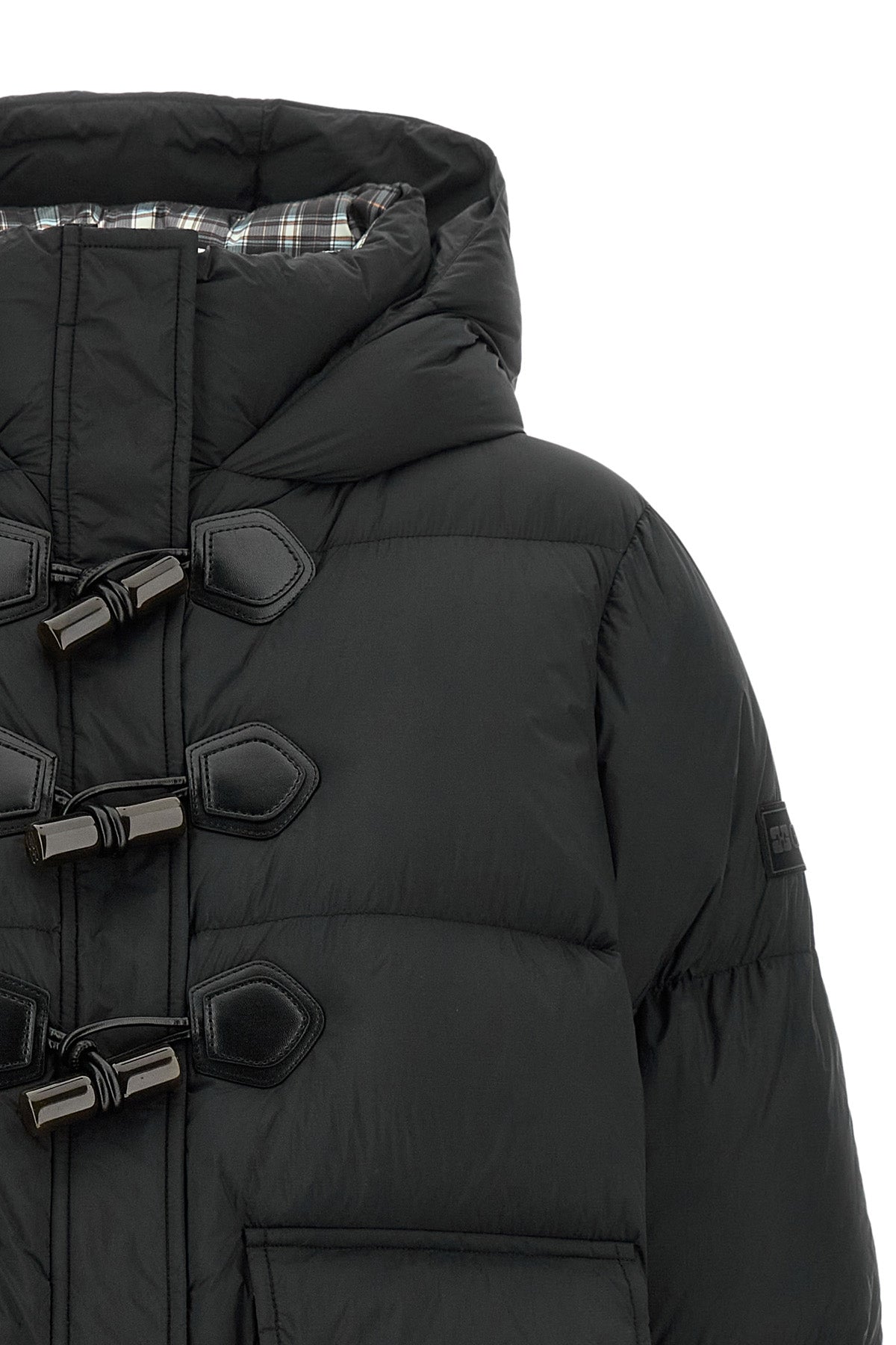 the ganni short down jacket redefines the codes of outerwear through a structure
