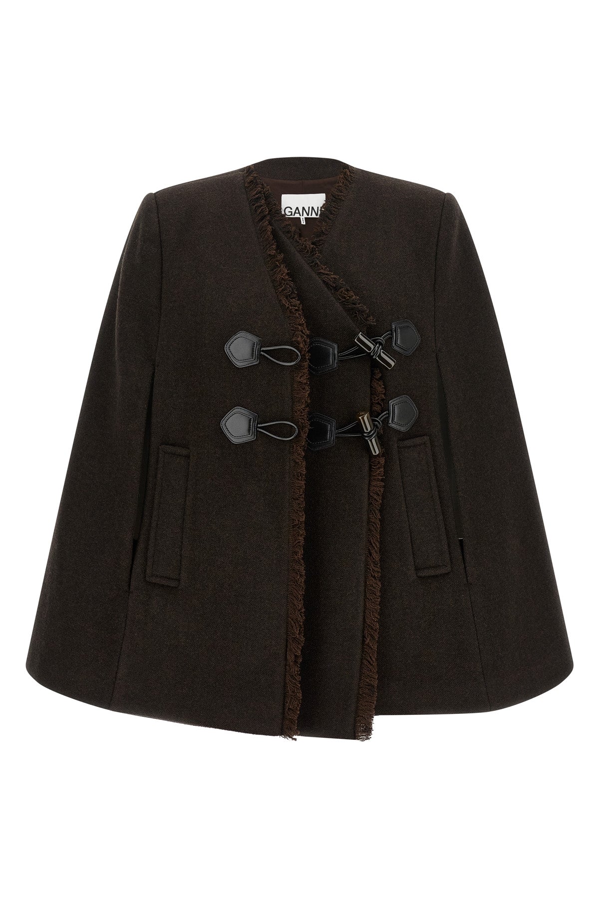 the ganni cape redefines the volumes of the outerwear through a flared and envel