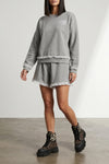 the ganni isoli shorts redefine casual style through a precise balance of text