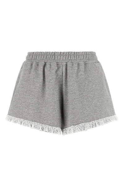the ganni isoli shorts redefine casual style through a precise balance of text