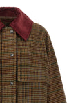 the ganni short jacket redefines the proportions of the outerwear through a boxy