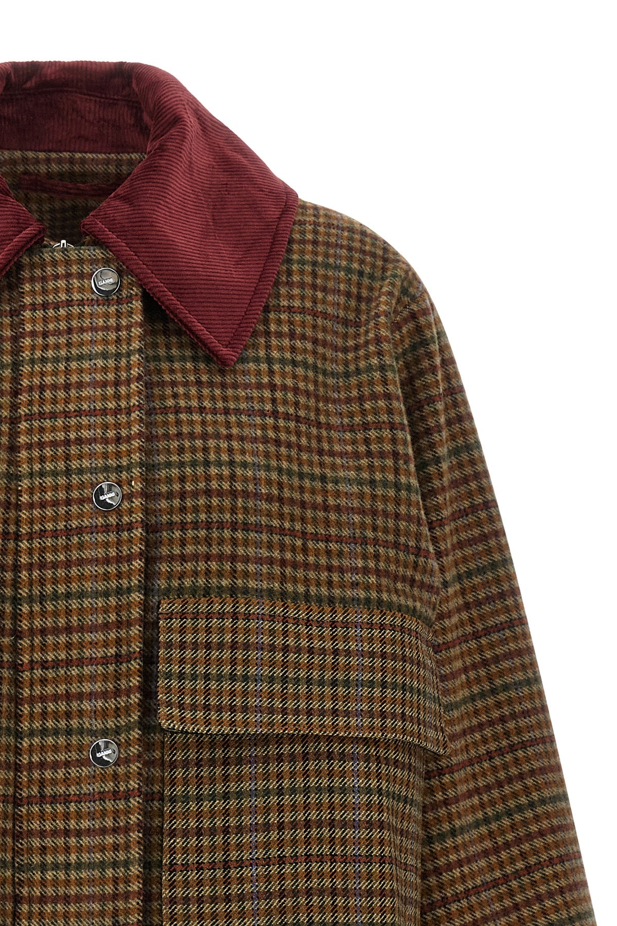 the ganni short jacket redefines the proportions of the outerwear through a boxy