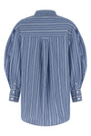 the ganni striped shirt redefines the codes of everyday tailoring through unexpe