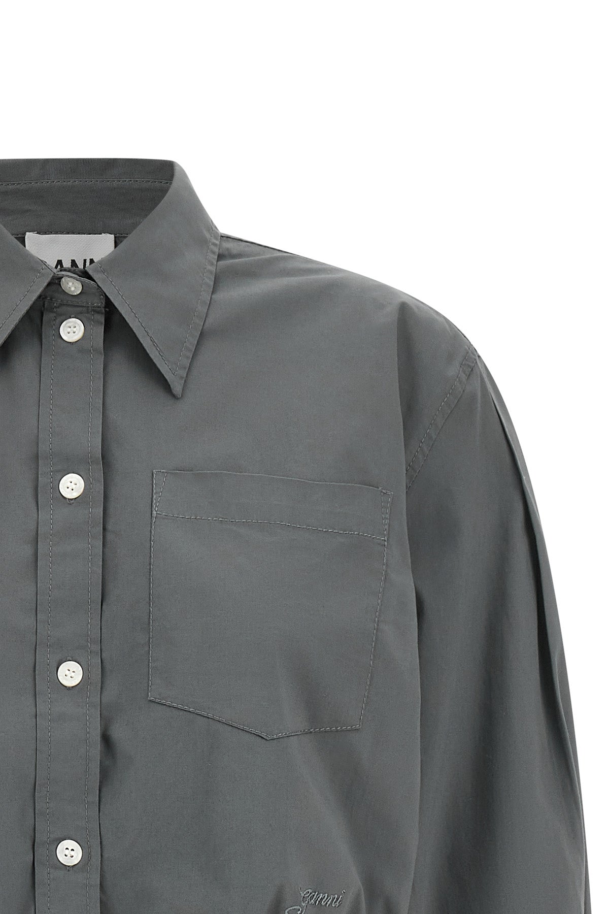 the ganni cropped shirt reinterprets the classic silhouette through shortened pr