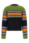 the ganni sweater redefines traditional knitwear through a bold play of color co