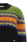 the ganni sweater redefines traditional knitwear through a bold play of color co