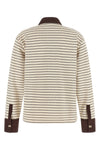 the long-sleeved polo shirt ganni redefines casual dress codes through meticulou