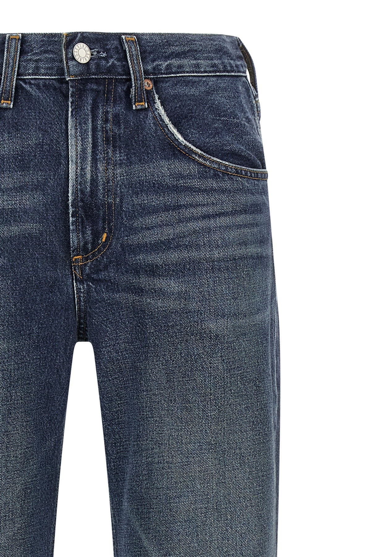 the kick boot agolde jeans redefine everyday denim through a mid-waist silhoue