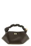 the ganni bou mini handbag redefines geometric volumes through a sculptural he
