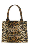 the large ganni leopard tote bag features a capacious silhouette made of cotto