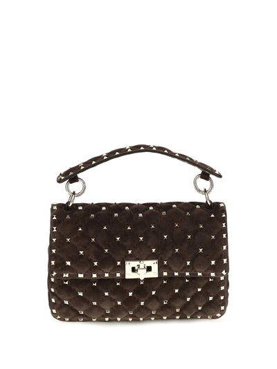medium rockstud spike suede top handle bag