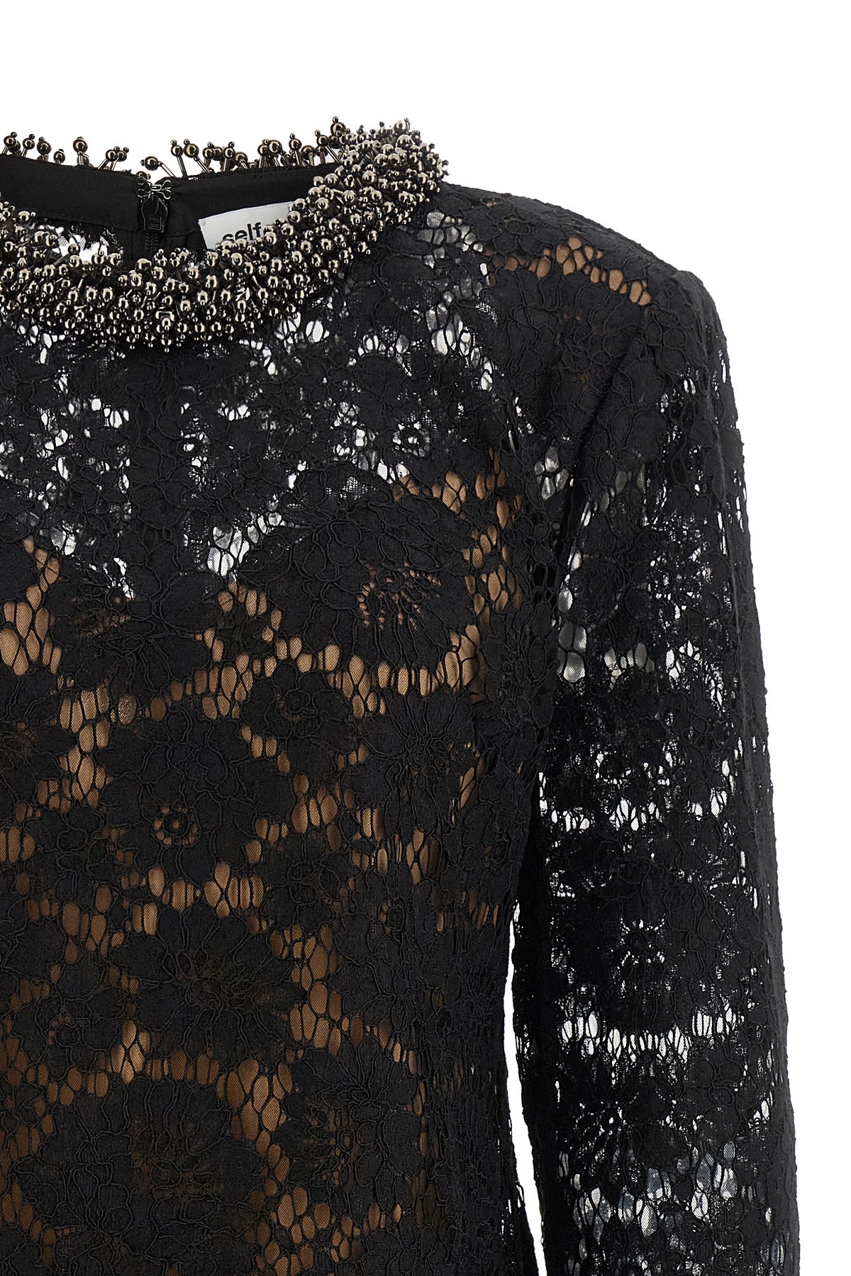 the self-portrait mini dress is built through a complex black floral lace workma