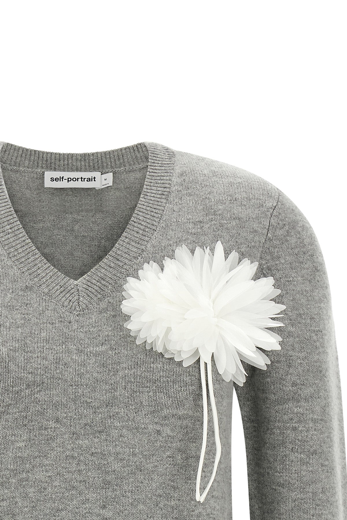 the self-portrait knit redefines classic knitwear through a romantic and structu