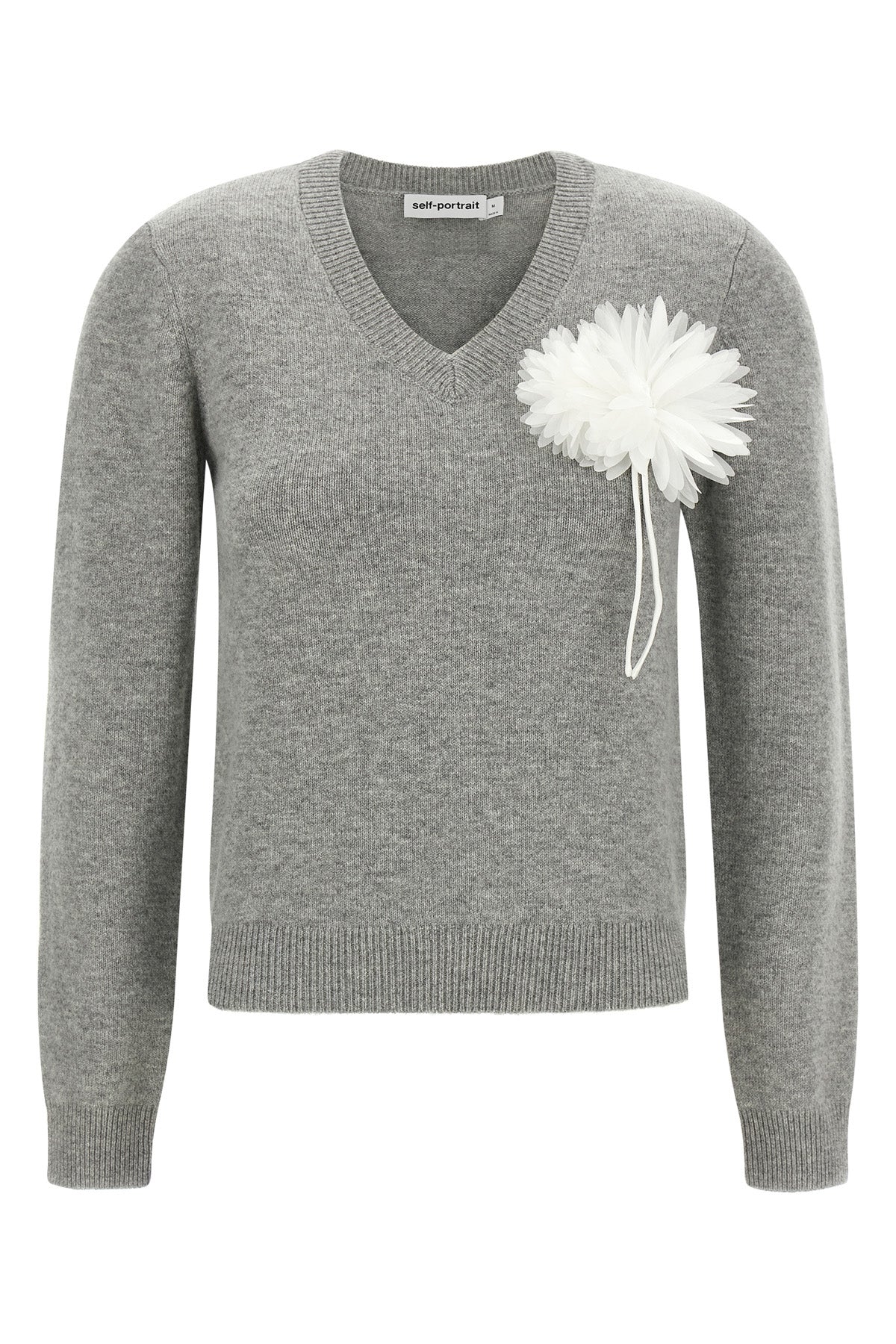the self-portrait knit redefines classic knitwear through a romantic and structu