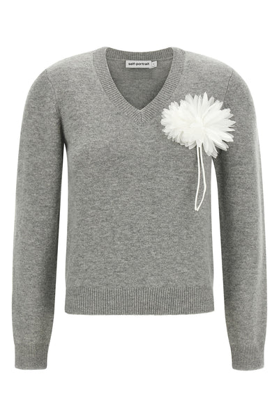 the self-portrait knit redefines classic knitwear through a romantic and structu