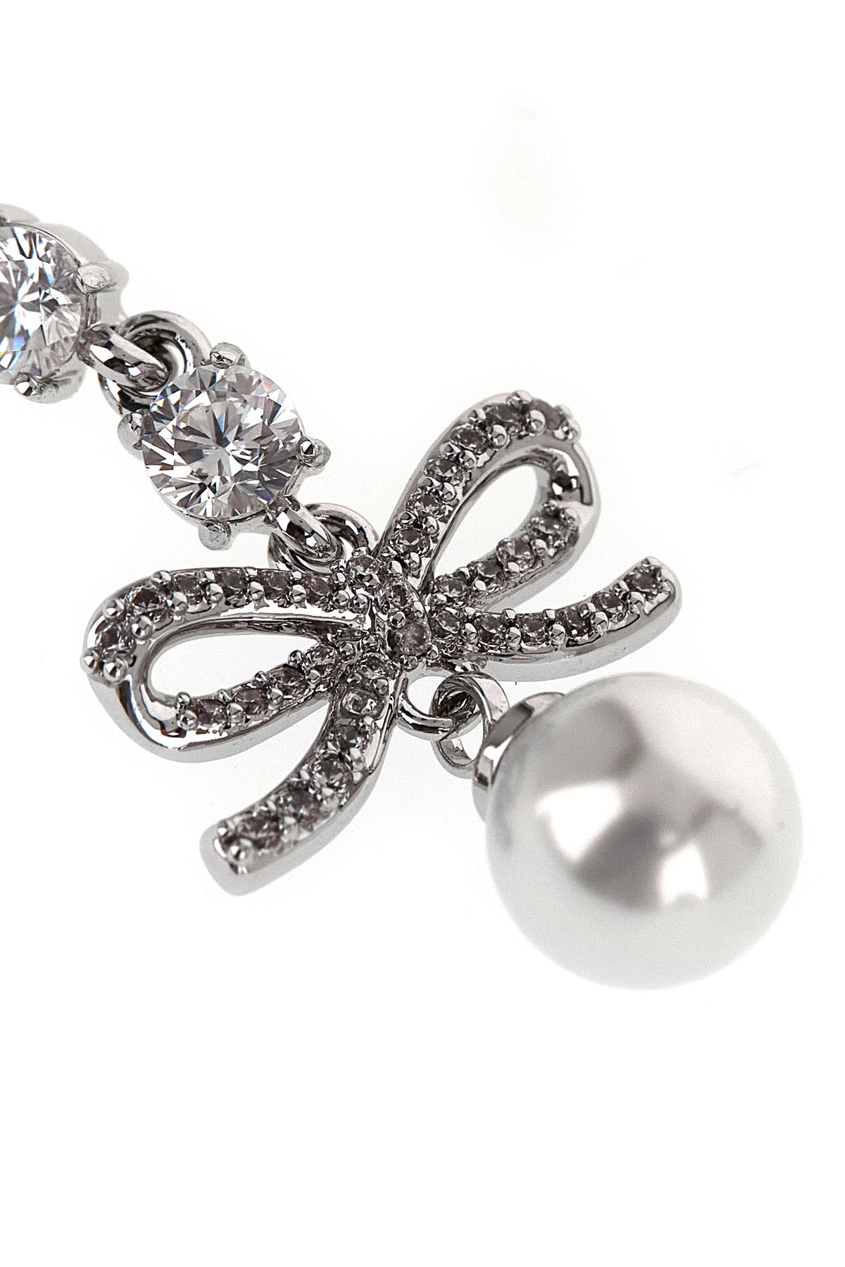 the self-portrait bow crystal charm pendant earrings feature a cascading metal