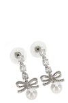 the self-portrait bow crystal charm pendant earrings feature a cascading metal