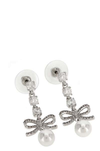 the self-portrait bow crystal charm pendant earrings feature a cascading metal