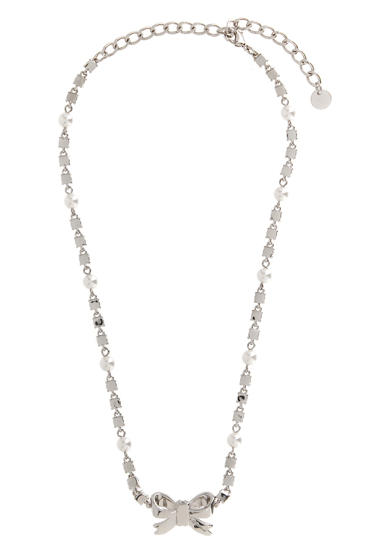 the self-portrait crystal pearl bow necklace defines the décolleté through a r