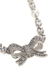 the self-portrait crystal pearl bow necklace defines the décolleté through a r