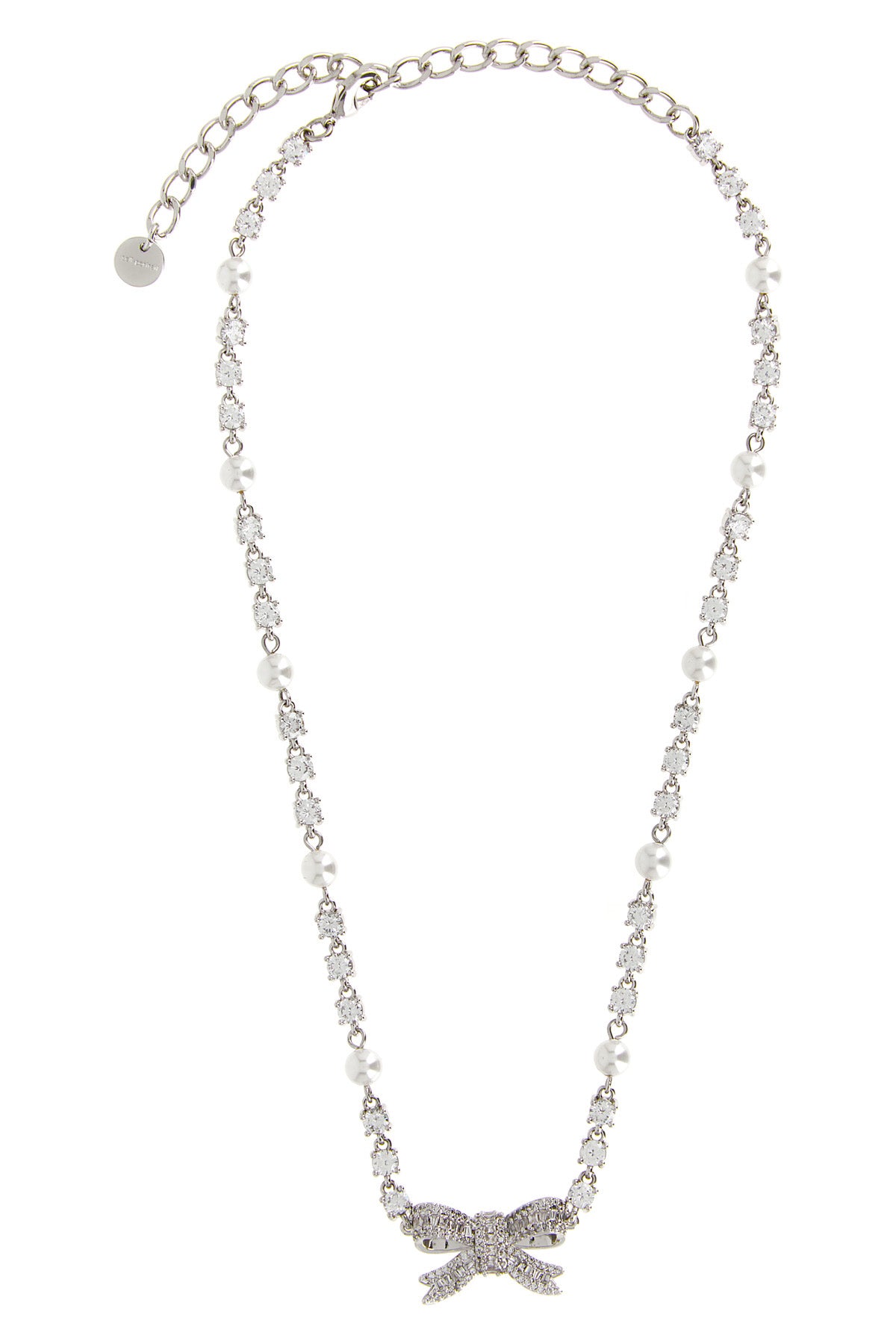 the self-portrait crystal pearl bow necklace defines the décolleté through a r