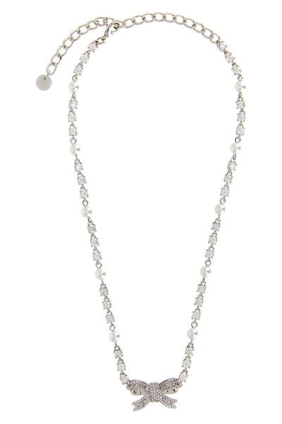 the self-portrait crystal pearl bow necklace defines the décolleté through a r