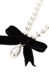 the black bow pearl necklace by self-portrait is structured on a continuous th