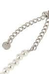 the black bow pearl necklace by self-portrait is structured on a continuous th