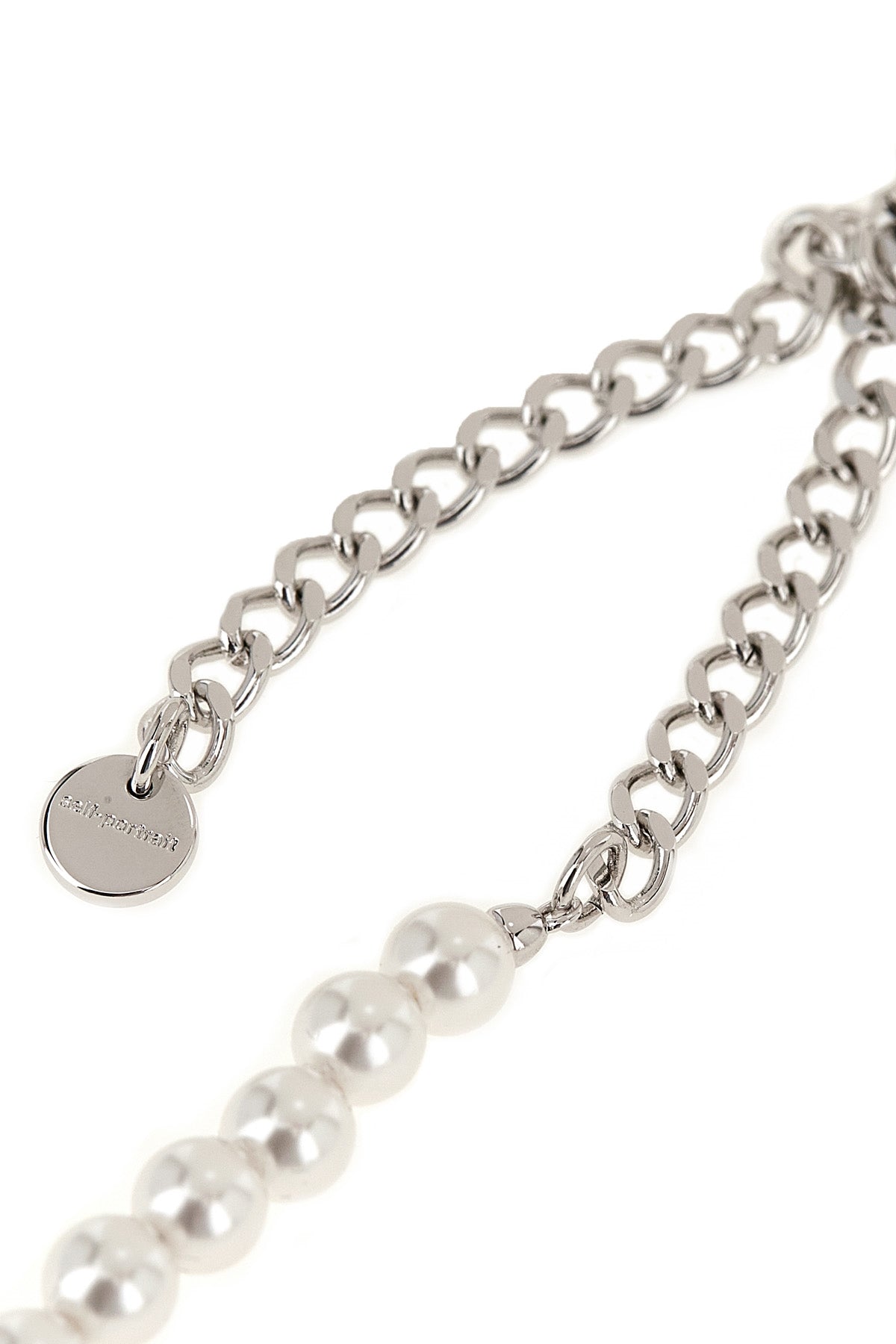 the black bow pearl necklace by self-portrait is structured on a continuous th