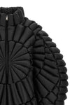 the raxxy down jacket redefines the volumes of outerwear through a complex three