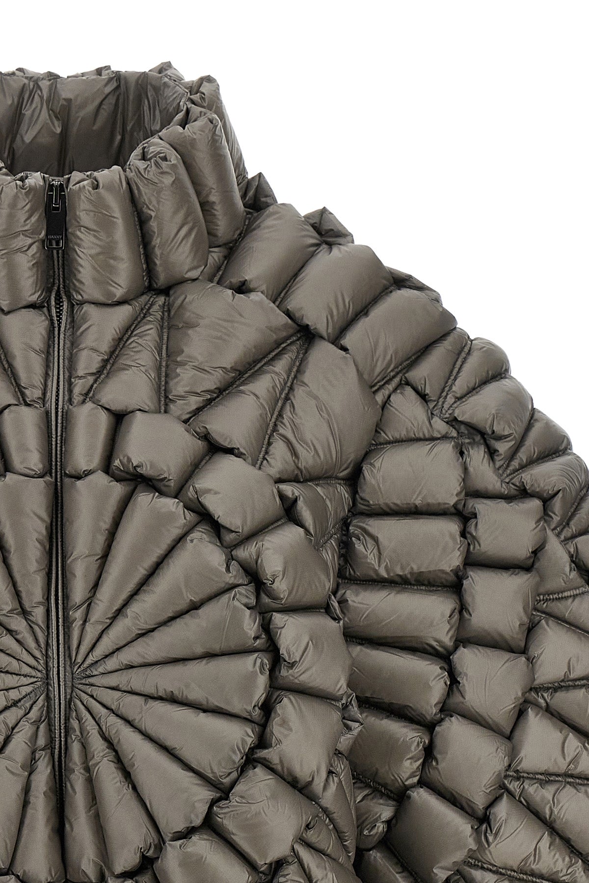 the raxxy down jacket redefines the volumes of outerwear through a complex three