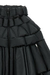 the raxxy cape redefines the volumes of outerwear through a complex three-dimens