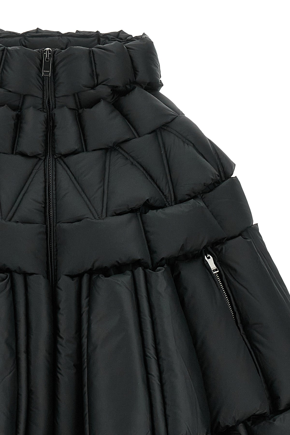 the raxxy cape redefines the volumes of outerwear through a complex three-dimens
